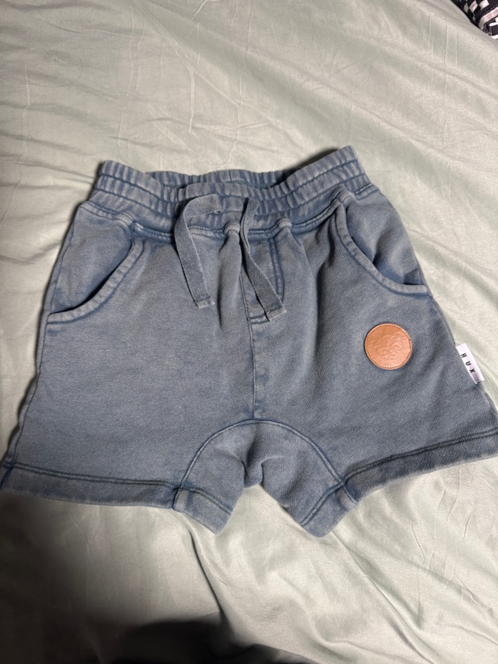 Huxbaby Slate Blue Drawstring Cotton Shorts with Patch


Never worn without tags